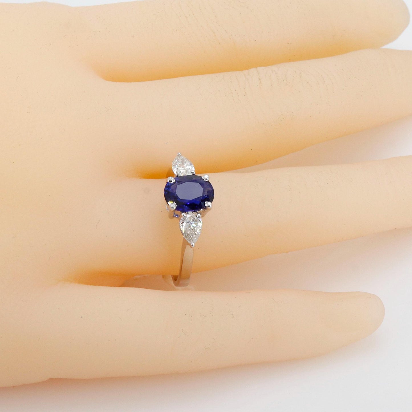 A Vibrant Oval Cut Sapphire At The Center Flanked By Brilliant Pear Cut This Ring 18K Gold