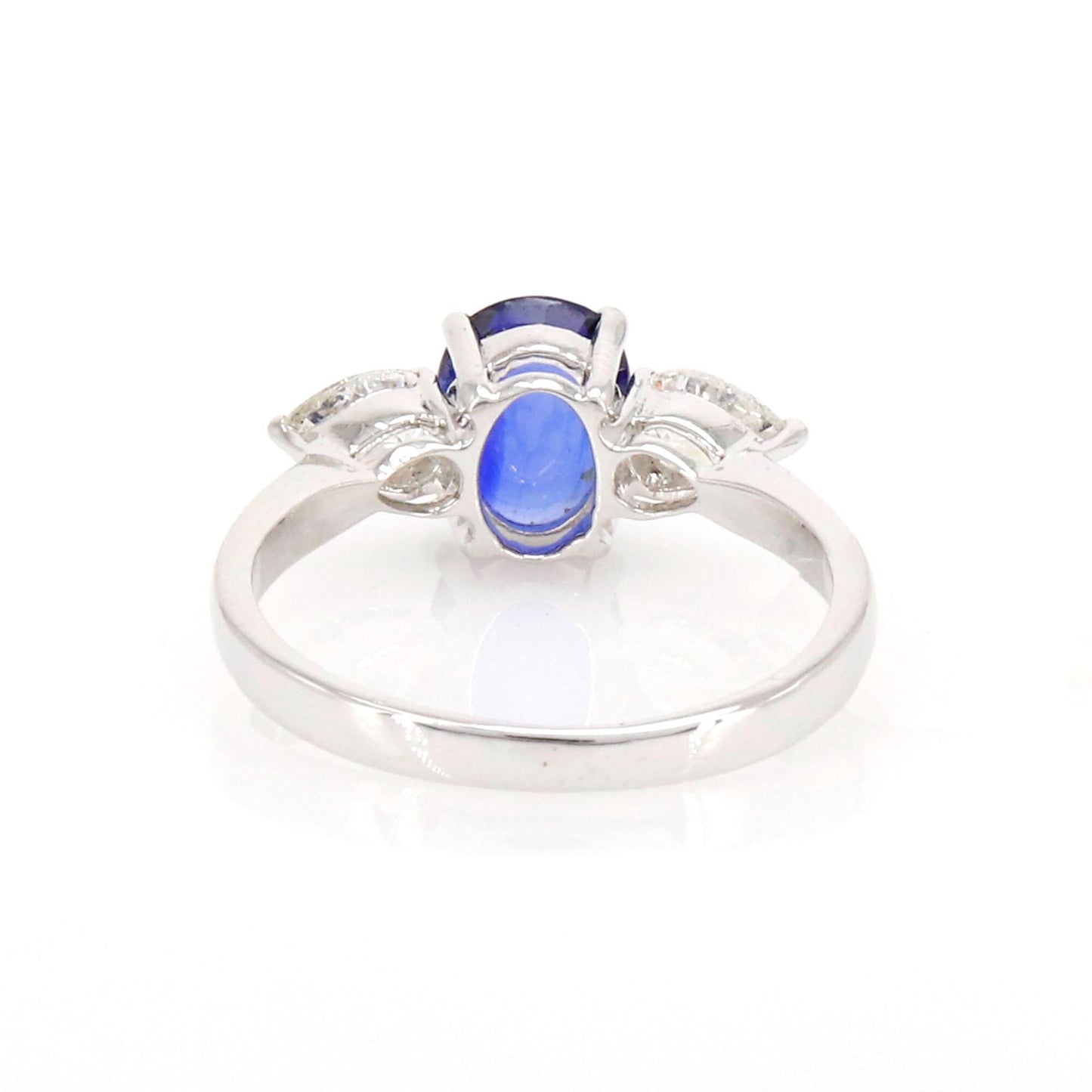 A Vibrant Oval Cut Sapphire At The Center Flanked By Brilliant Pear Cut This Ring 18K Gold