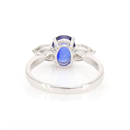 A Vibrant Oval Cut Sapphire At The Center Flanked By Brilliant Pear Cut This Ring 18K Gold