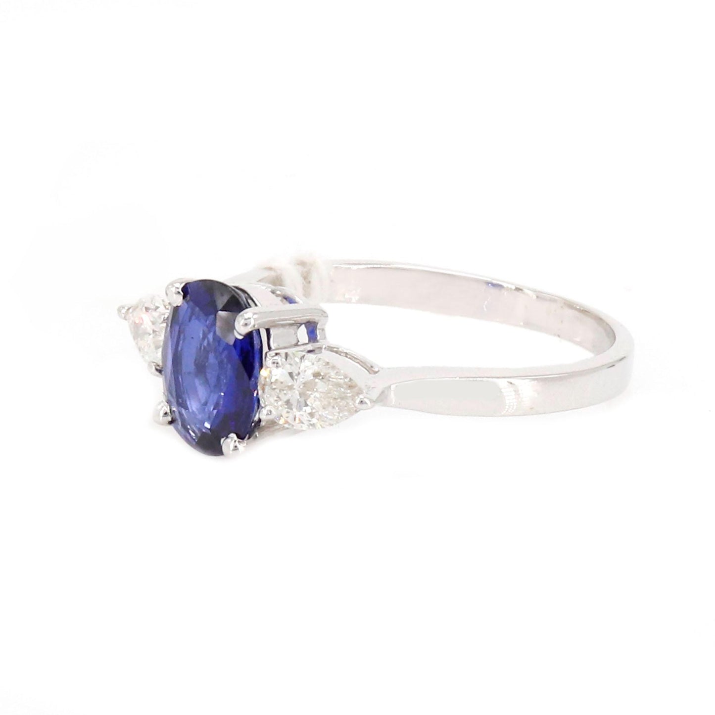 A Vibrant Oval Cut Sapphire At The Center Flanked By Brilliant Pear Cut This Ring 18K Gold